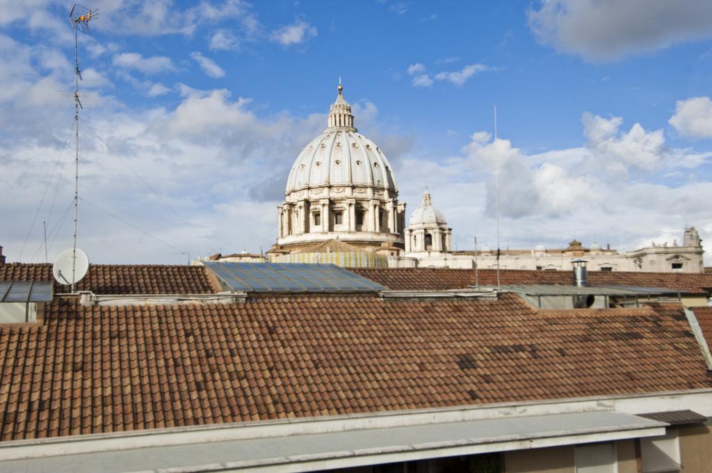 Bed & Breakfast Armonie Romane Exterior photo View of the dome of St. Peter's Basilica from the roof of the hotel